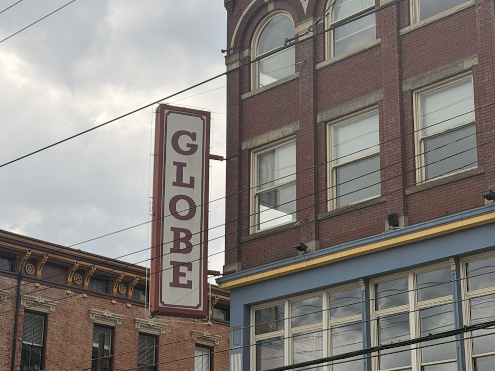 The vertical GLOBE sign on the Globe Building near Findlay Market.