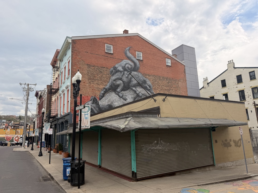 A giant rat mural on the side of a building near Findlay Market.