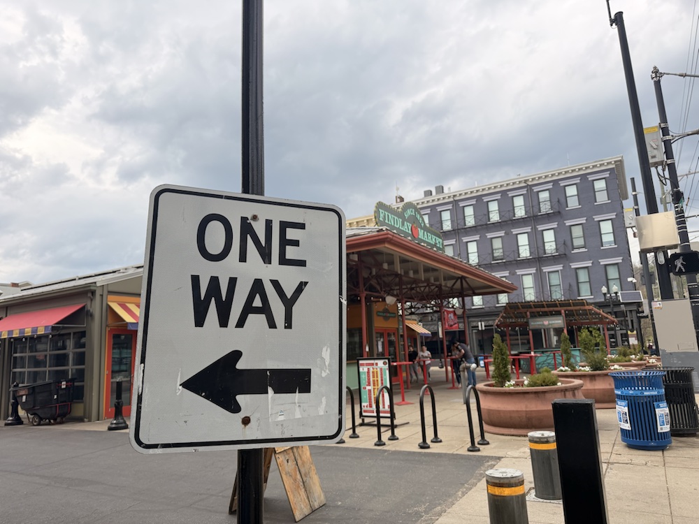 A One Way sign in front of Findlay Market.