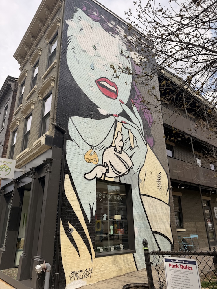 The Margo mural by D*Face on the side of the Artichoke building near Findlay Market.